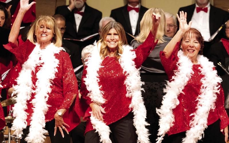 Charlotte Mosteller, Maureen Brower and Lu Feldman dance the dance. LEIGH LOFGREN/Staff