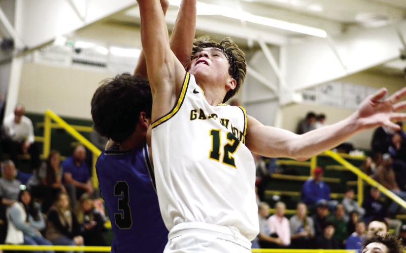 The thousandth point in action! With this score against Trinity Christian, Gatewood’s Matt Allen (12) put the final two points on the board to earn him membership in the exclusive 1,000-points club. As a sophomore, Allen still has plenty of time to add to his career total, too. IAN TOCHER/Staff