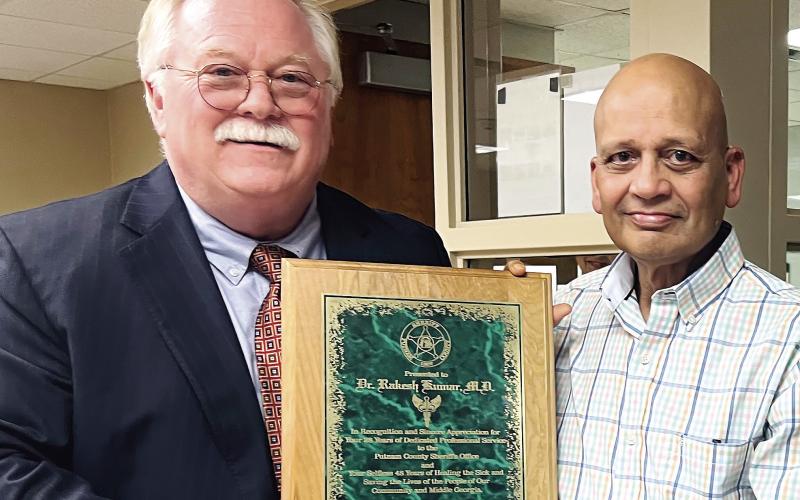 Long-time Putnam County Sheriff Howard Sills (left) pictured with Dr. Rakesh Kumar (right). IAN TOCHER/Staff