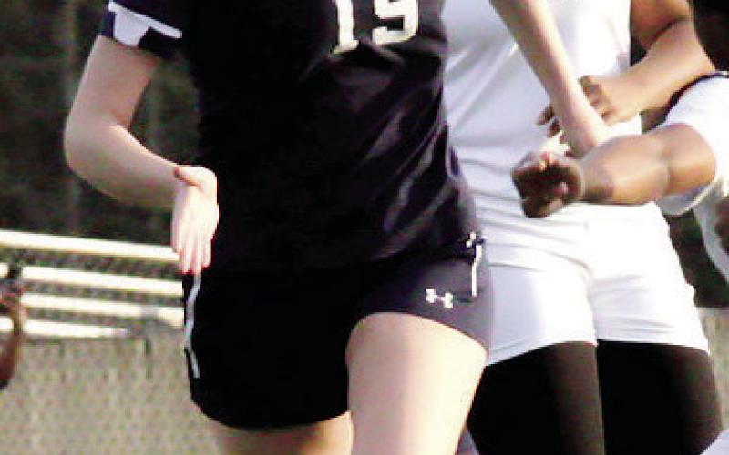 Elizabeth Haley (19) tries to steal the ball away from a Butler defender. TREY NORRIS/Staff