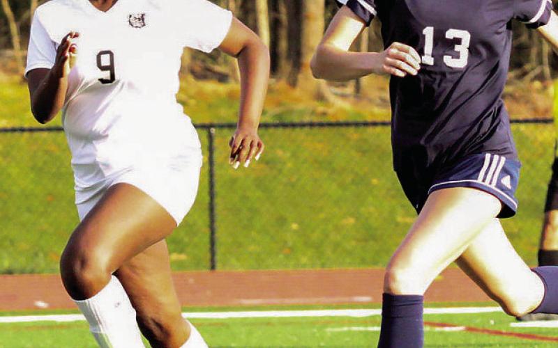 Lily Frisch (13) looks for an opportunity to strike last week in win over Butler. TREY NORRIS/Staff