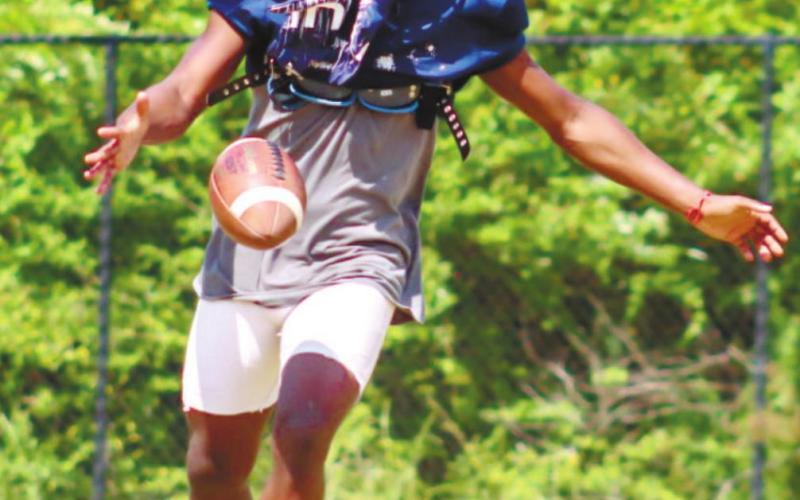 War Eagles' punter DJ Bland (4) working on his skills during special teams drills. LANCE McCURLEY/Staff