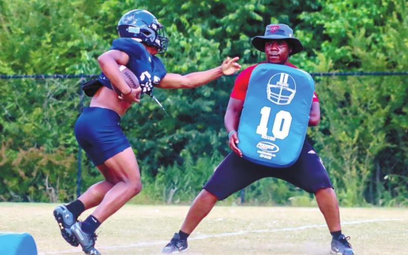 Putnam County running back Tamarion Peters (27) shifts gears, rotating his feet during a drill last week.