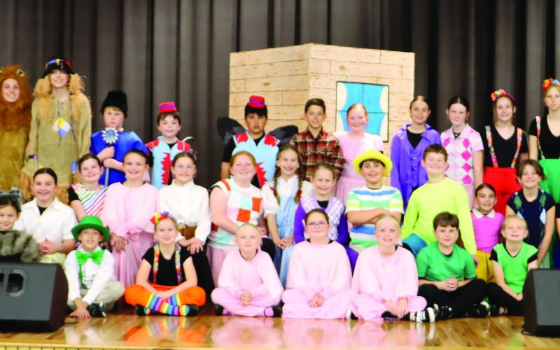 Gatewood music and drama teacher Beth Mappes (standing, second from left) led a sizable crew and cast in presenting the classic “Wizard of Oz” to sold-out crowds last week at the Eatonton-based school. CONTRIBUTED