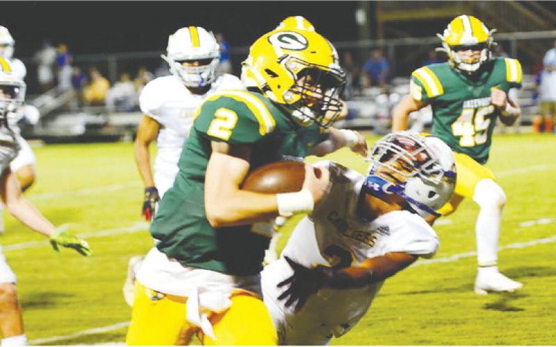 Back-up quarterback Ben Brannen (2) pushes off an Augusta Prep defender on his way to scoring a third-quarter touchdown in Gatewood’s 62-6 win over the visiting Cavaliers. IAN TOCHER/Staff