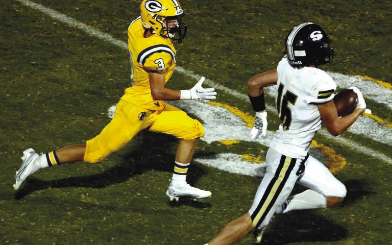 Jackson Hewatt (3) made some great plays on both sides of the ball, including this run-down of the Raiders’ Trey Sellers (16).