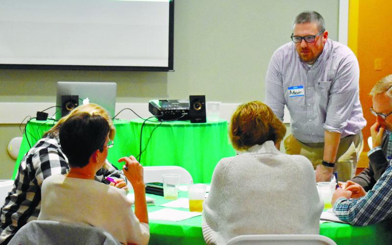 GaFCP Regional Manager Adam Swymer checks on the discussion in one of the small groups.