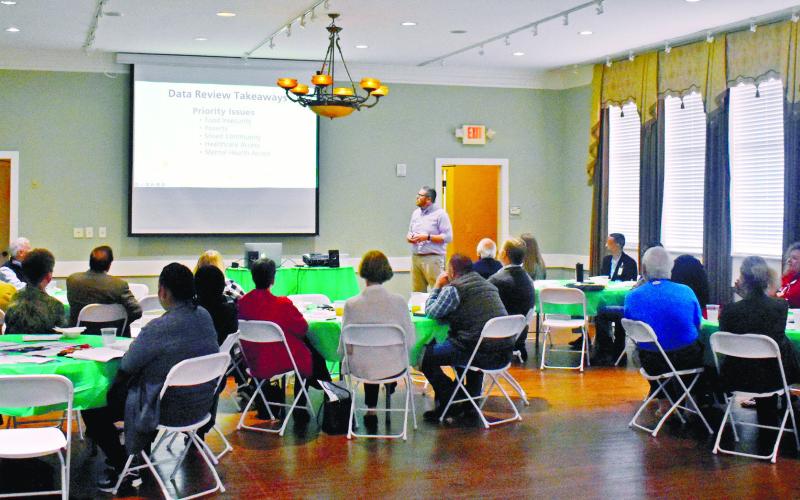 Representatives of the Putnam County educational system, healthcare sector, local non-profits and churches and the community members, who gathered to discuss and find solutions to the community problems, listen to the introductory speech by GaFCP’s Adam Swymer.