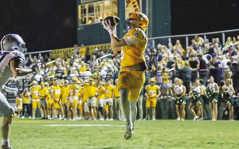 Drew Love catches a pass for a touchdown in Gatewood’s annual “Gold Out” game in support of Childhood Cancer Awareness Month. TREY NORRIS//Staff