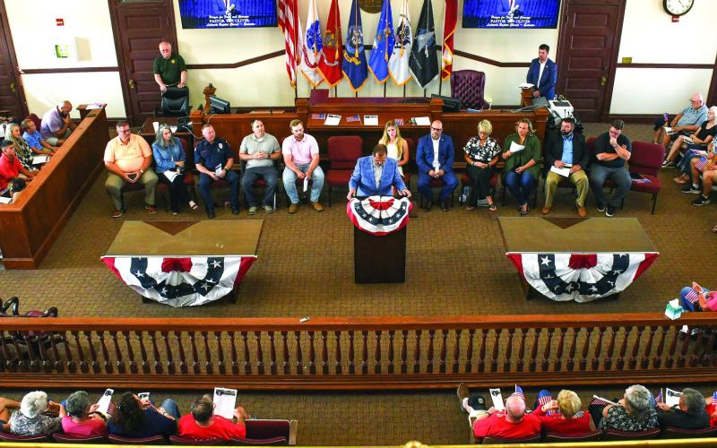 Pastor Tim Oliver of Lakeside Baptist Church (at podium) gave a wide-ranging, often forceful speech about faith and courage. IAN TOCHER/Staff