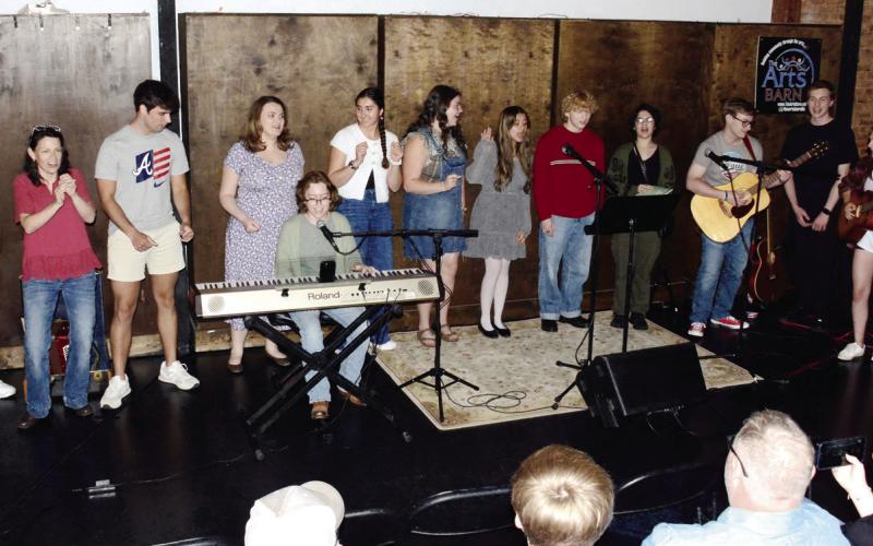 Around 10 entertainers took turns at the microphone at Sylvia's Coffee in downtown Eatonton. (IAN TOCHER/Staff)