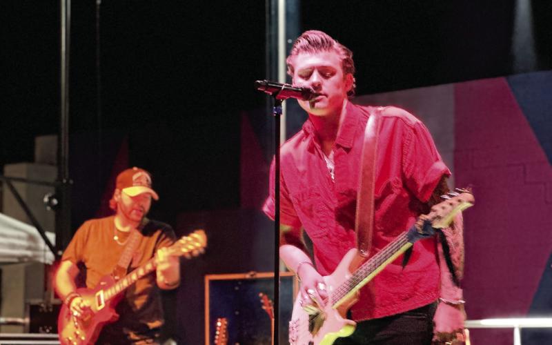 Logan Crosby and his bandmates returned to his hometown to perform on the Deep Roots stage. Deep Roots aims to highlight local talent and offer a free performance for visitors and locals. ALIVIA BLANTON/Staff