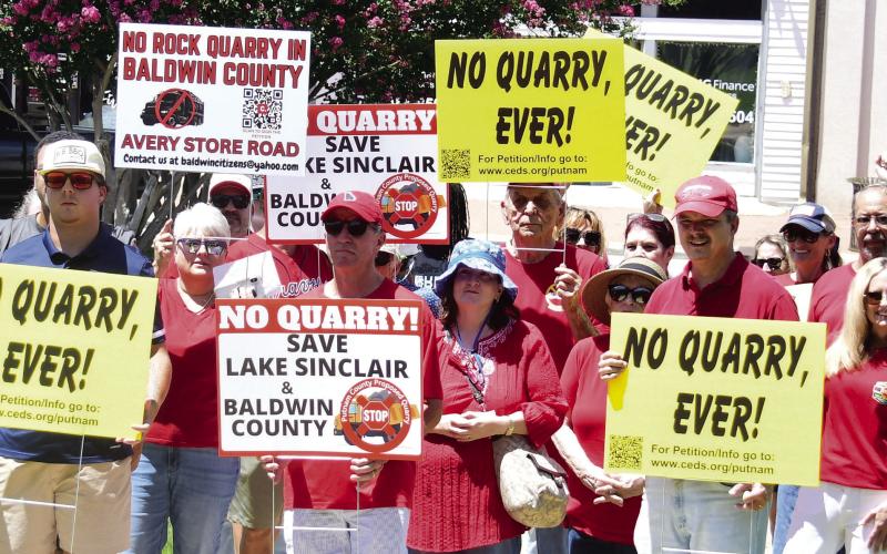 Protestors from Putnam and Baldwin counties combine Sunday afternoon on the Putnam County Courthouse lawn to commiserate and share their concerns about three potential quarry projects coming to Lake Country. IAN TOCHER/Staff