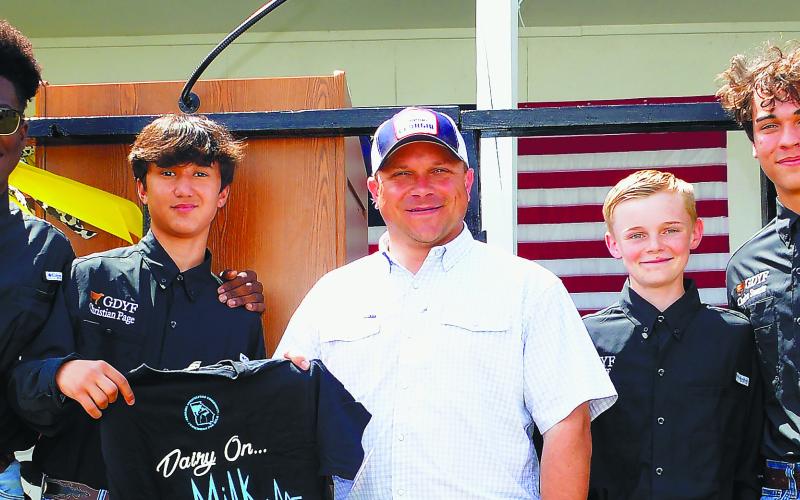 Georgia Agriculture Commissioner Tyler Harper (center) took time for a photo op with Georgia Dairy Youth Foundation junior board members (l-r) Seth Harris, Christian Page, Luke Huff and Caden Swartz.