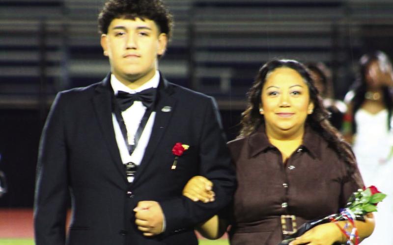 Putnam County High School’s 2026 Homecoming Queen and King, Chloe Gill and Jose Sanchez, are shown with their parents (right). PHOTOS CONTRIBUTED