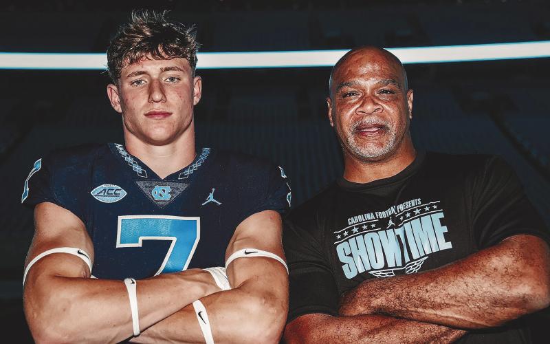 Bennett (left) with Tarheels’ defensive backs coach Tommy Thipgen (right), who was his main contact at UNC during the recruitment process. CONTRIBUTED