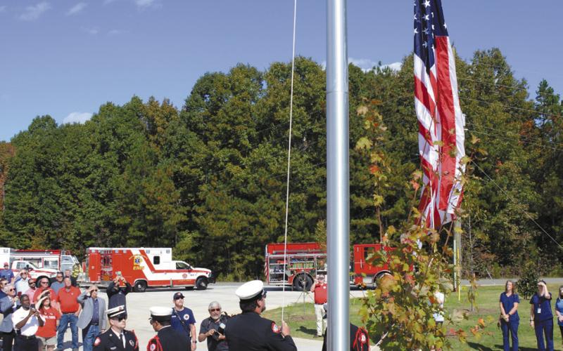 The Putnam County Fire Department Color Guard handled the first official raising of the flag at the new station IAN TOCHER/Staff