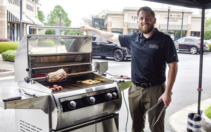 Stephen Montgomery with Fire Magic Premium Grills cooked brats, burgers, grilled fruit, pizza and more to show off one of the company’s grills. CONTRIBUTED