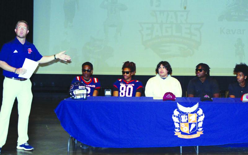 Putnam County head coach Joel Harvin (left) speaks about the five seniors, (l-r) Kavar Andrews, Jason Clemons, Noah Long, Rashod Daniel, and Jamarion Robertson. IAN TOCHER/Staff