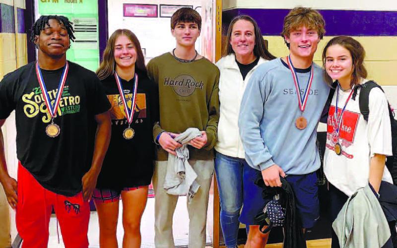 L-R; Brayon Farley, Amber Winslette, Joseph Mashburn, Hollie Key, Mark Winslette, and Lily Frisch after the South Metro Invitational. CONTRIBUTED
