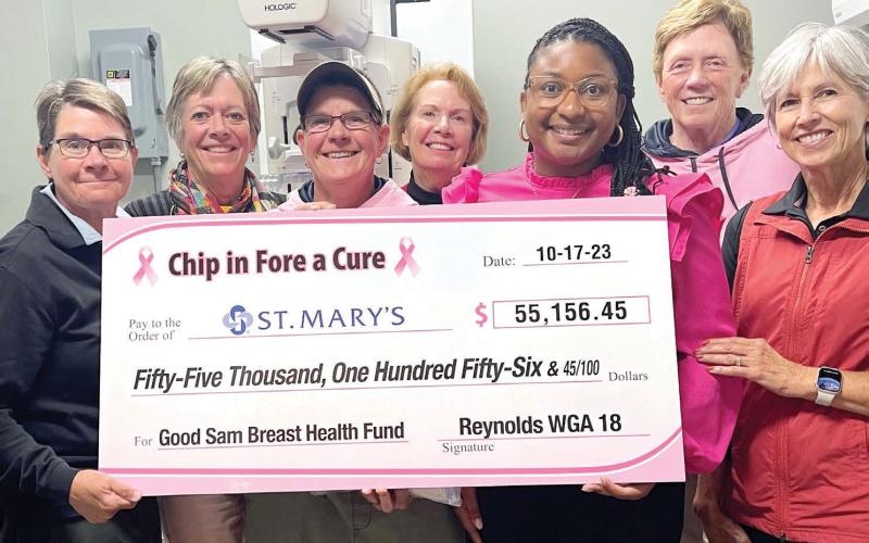 Members of Reynolds Women’s Golf Association 18 Holers present a check from this year’s Chip in Fore a Cure to St. Mary’s Good Samaritan Hospital in one of the hospital’s mammography rooms. CONTRIBUTED