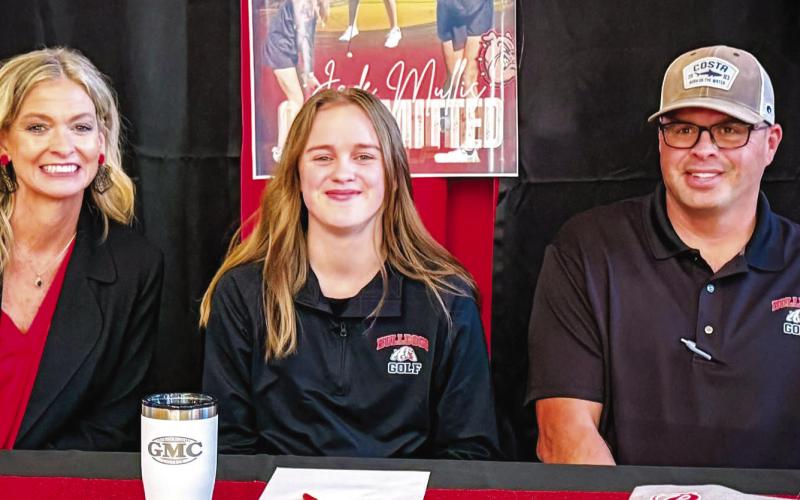 Flanked by her parents, PCHS senior Jade Mullis recently commited to continue her golfing career and education at Georgia Military College in Milledgeville. CONTRIBUTED