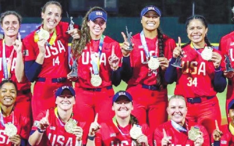 USA softball staff AND TEAM members claim their first place medals after taking down Japan. CONTRIBUTED