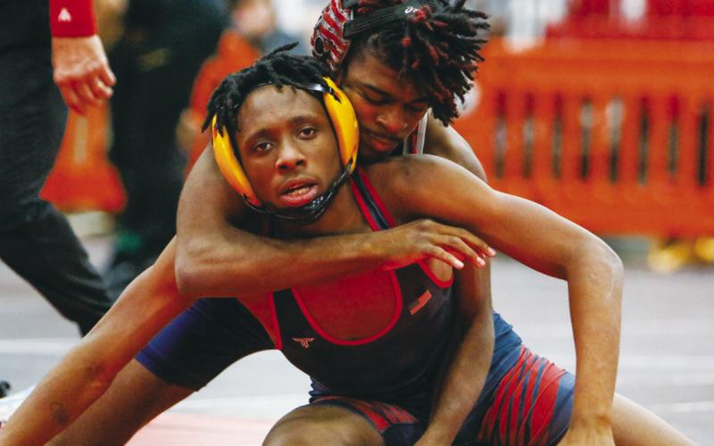 War Eagle sophomore Jamaiel McClendon applies an arm bar across his opponent’s chest. LANCE McCURLEY/Staff