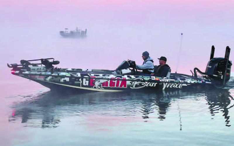 Anglers depart beneath an early morning fog hovering over Lake Oconee. CONTRIBUTED