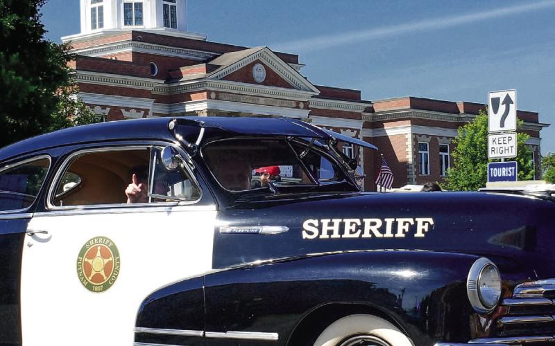 Putnam County Sheriff Howard Sills led the way in his well-restored but largely original 1948 police car.