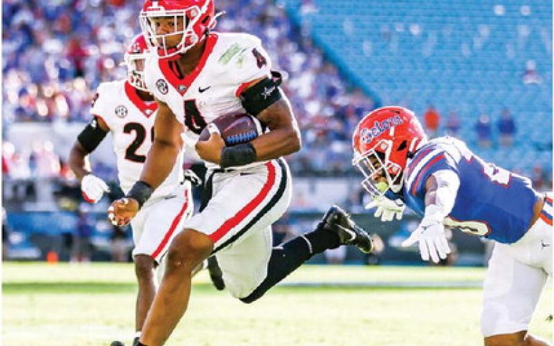 Linebacker Nolan Smith (4) records one of two interceptions for the Bulldogs, leading to an eventual touchdown in 2021. MACKENZIE MILES/UGA Athletics