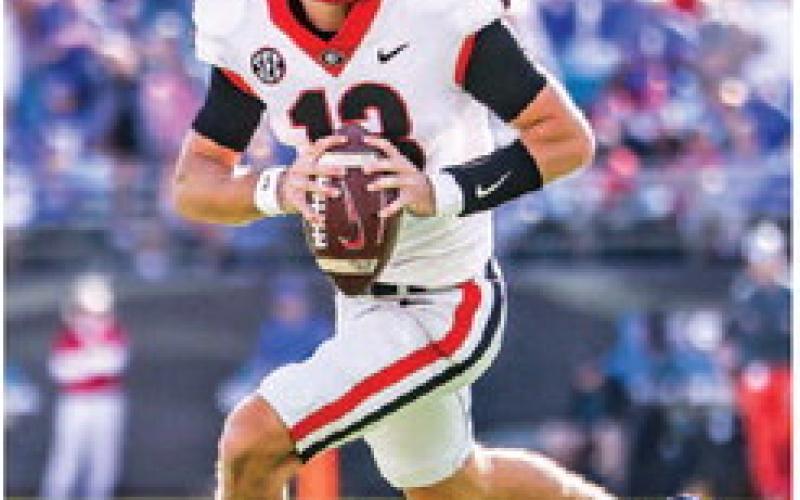 Quarterback Stetson Bennett rolls out of the pocket during the 2021 matchup with the Gators. Bennett went 10-for-19 for 161 yards. MACKENZIE MILES/UGA Athletics