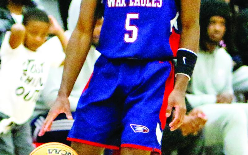 Senior Jaylin Harper (5) scored 14 points in a win over Hancock Central on Nov. 30. LANCE McCURLEY/Staff