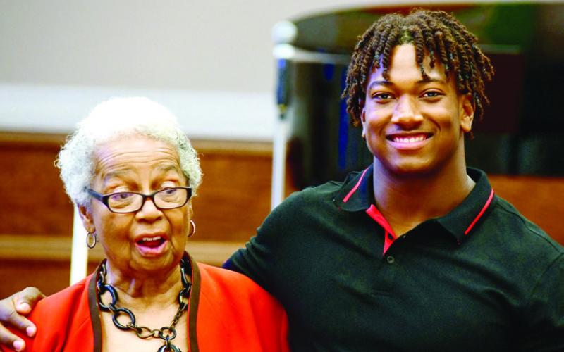 Georgia Benjamin-Smith called recent Putnam High grad Amario up from the audience to share a little of his story as he prepares for college life. IAN TOCHER/Staff