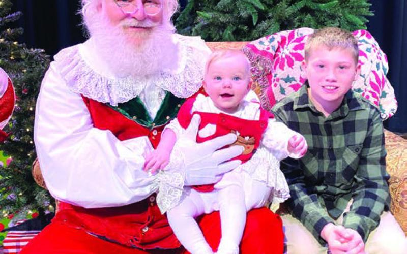 Naughty or Nice? Hunter Lukes, age 8, and his baby sister Zoey were definitely nice this year and couldn’t wait to see Santa! EMME CLAUSE/Staff