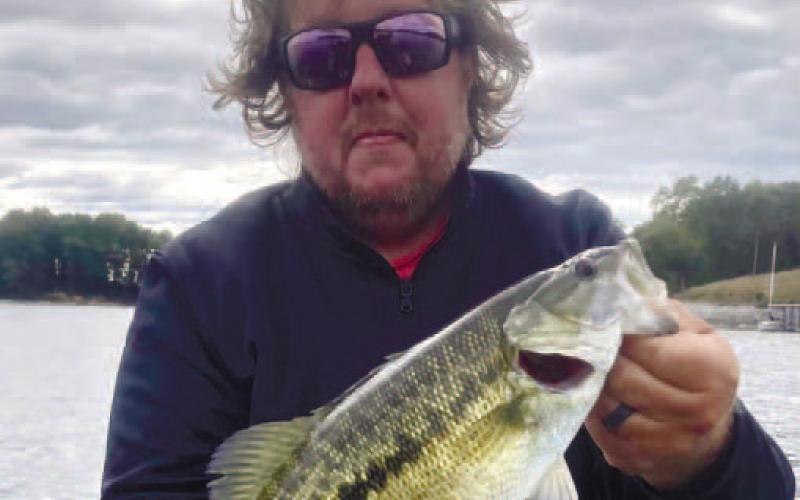 Pressley with a spotted bass on Lake Lanier.