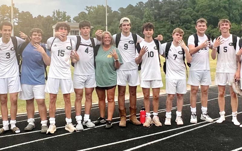 The 2024 Gatewood Gators soccer team includes (l-r): Adam Harvey, Grayson Lattimore, Caleb Harvey, Parker Holle, Bodie Corry, Colt Jenkins, coach Cindy Gregory, Gage Rainey, Jayden Daniel, Charlie Randolph, Luke McNeil, Blake Callaway, JT Gregory, and John Van de Planque. CONTRIBUTED