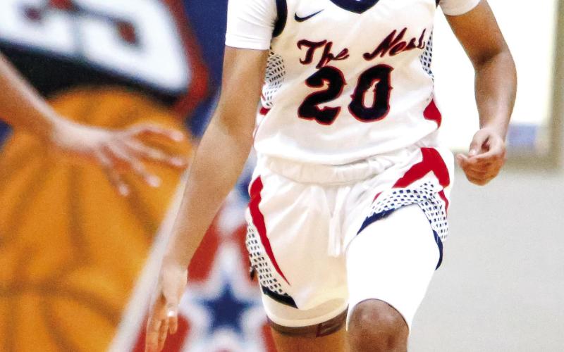 Putnam County freshman Jada Baker brings the ball up the floor in transition during a game earlier this season. LANCE McCURLEY/Staff