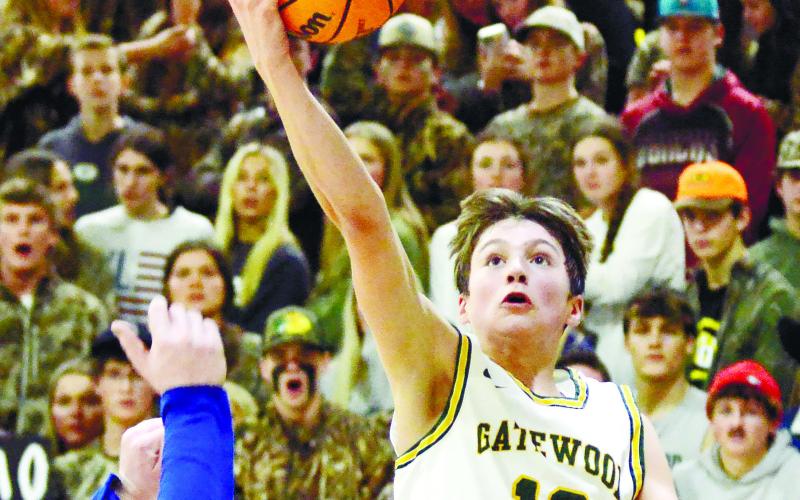 Gatewood freshman Matt Allen (12) goes up for a layup against Brentwood in Friday’s region victory. IAN TOCHER/Staff