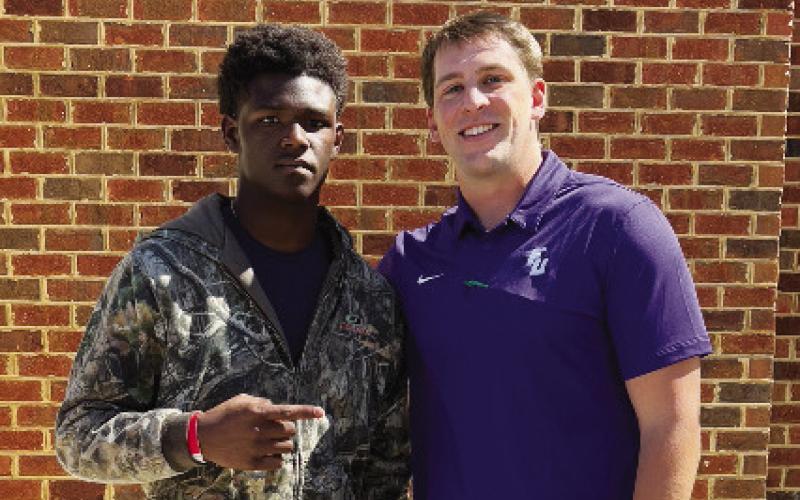 Brown with Furman tight ends coach Grayson Kline on a visit. CONTRIBUTED
