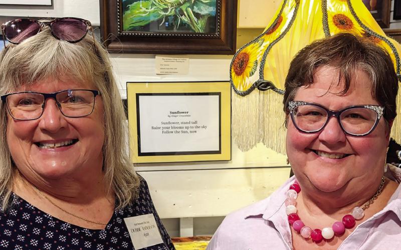 Artist Debbie Anderson (left) submitted her artwork “Potential,” inspired by author Ginger Crosswhite’s “Sunflower,” a haiku style poem. CONTRIBUTED