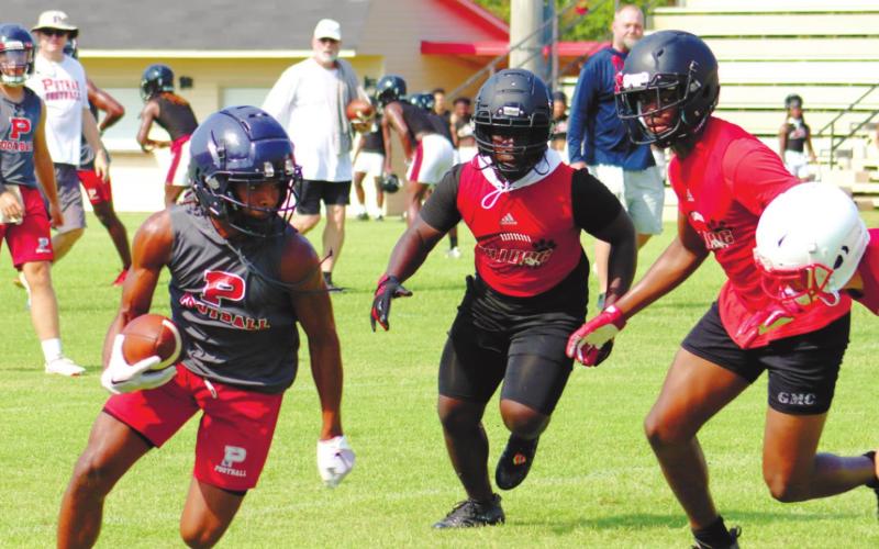 Rising senior DJ Bland catches a pass and tries to find a hole downfield. ARELLA CASH/Staff