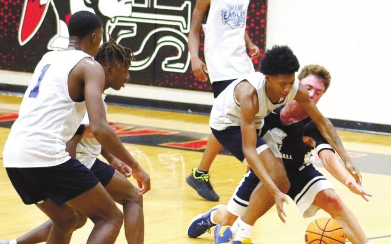 Keyni Crawford fights hard for a rebound against JMA. ARELLA CASH/Staff