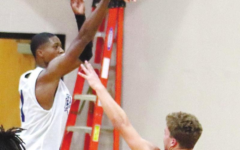 Banks (3) jacks up a 3-pointer from the corner. ARELLA CASH/Staff