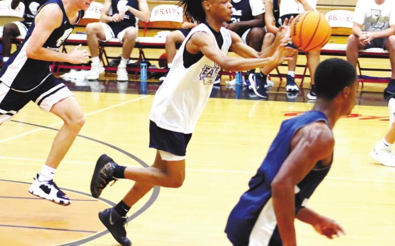 Messiah Walker gets the ball down court for the Eagles. ARELLA CASH/Staff