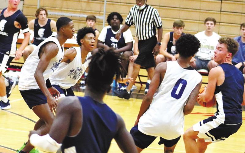 On defense for the War Eagles are, from left, Eren Banks, Keyni Crawford and Peyton Ellison. ARELLA CASH/Staff