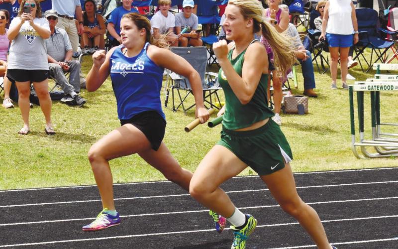 Anna Williamson finishes up a relay event. T. MICHAEL STONE/Staff