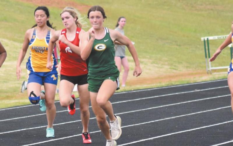 Eighth grader Lauren Sills finished first in her heat in the 100-meter dash. T. MICHAEL STONE/Staff