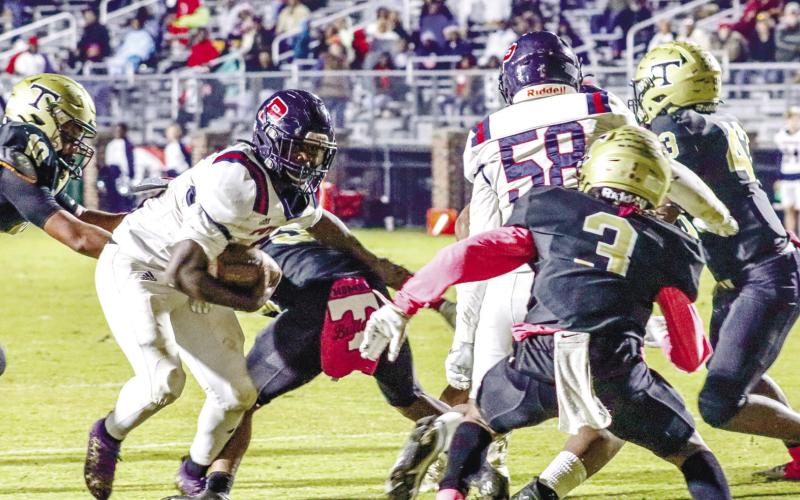 Putnam County running back Rashod Daniel (3) tries to break a tackle in last season’s loss to Thomson. LANCE McCURLEY/File photo