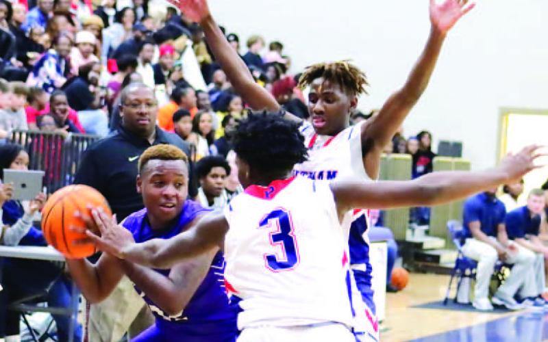 Kaleb Crawford (3) guards a Jasper County player in Friday night’s win over the Hurricanes. ARELLA CASH/staff